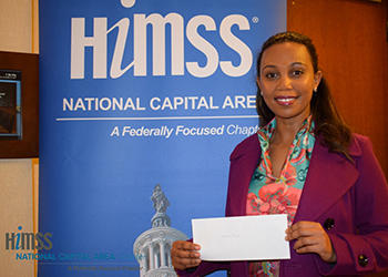 Mina Yirga Hailemariam receiving award from HiMSS